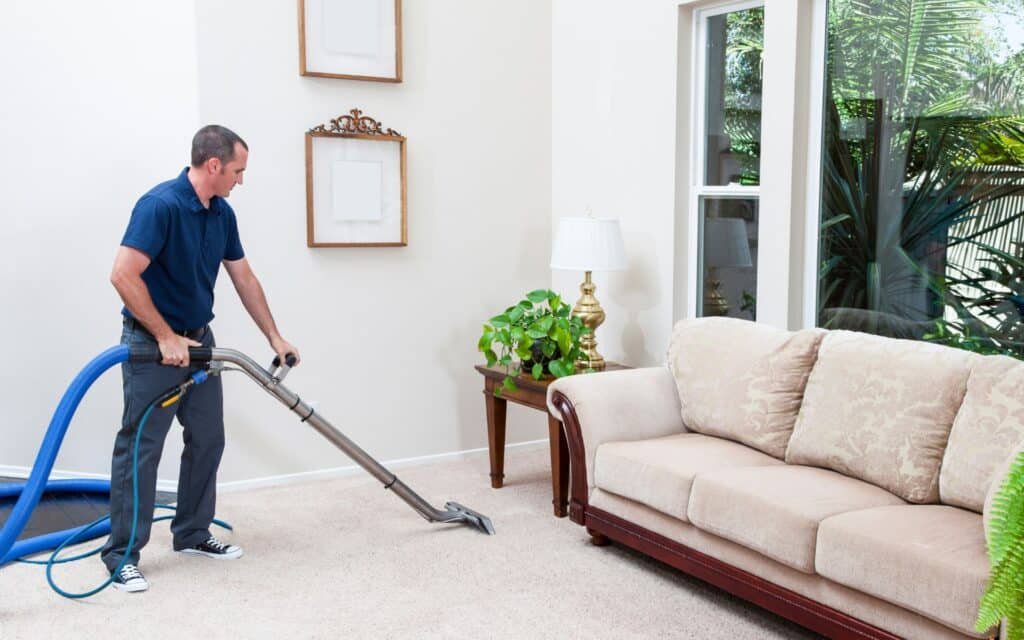 Man cleaning a Carpet cleaning costs